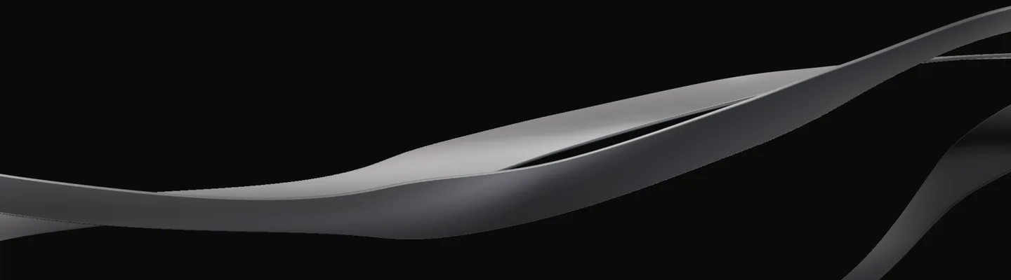 The home page's first screen with the text taken away: on black, the ribbons alone, one broad graphite band sweeping up from the left with a lit edge along its crest, a second one opening beneath it, a third turning away at the right.